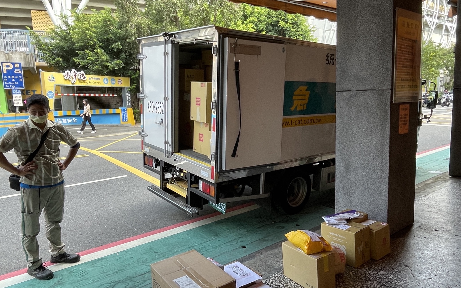 Couriers arranging parcels for final-stage home delivery